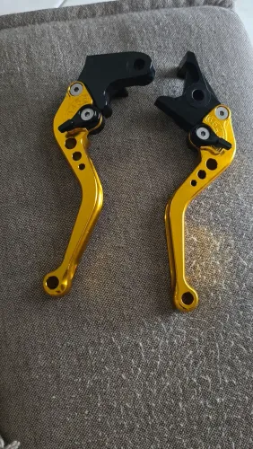 Manete esportiva dourada