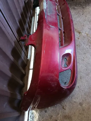 Para-choque original,Corsa , com lugar de por farol de milha, precisa de pintura