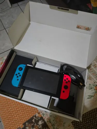 Nintendo Switch destravado + sd 128gb cheio de jogos em excelente estado.