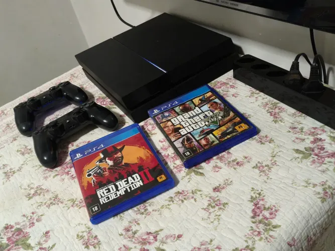 Ps4 1terabyte(+2 controles + jogos+ mais fio de linha protetor de surtos)