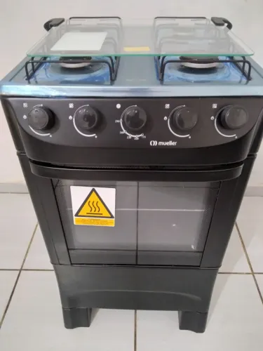 Vendo fogão " MUELLER " NOVO " NOVO "' NO PLÁSTICO ".