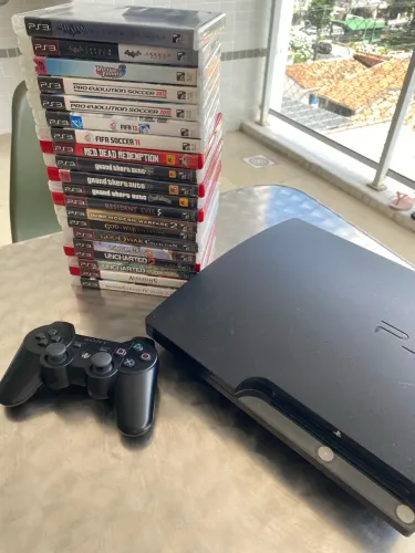 PS3 Slim + 20 jogos originais