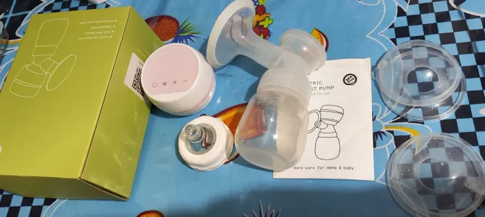 Bombinha de tirar leite e concha