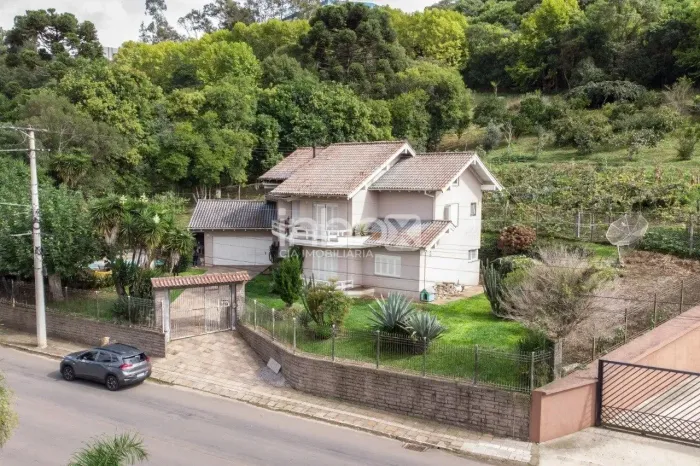 INBOX CIA IMOBILIÁRIA VENDE: Excelente imóvel com casa com quiosque e piscina no Bairro Ta