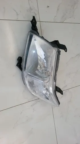 Farol esquerdo hilux 12/15