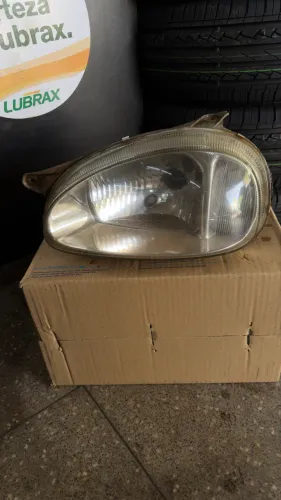 farol esquerdo motorista original corsa 00 a 2009