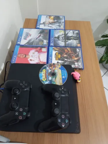 ? PlayStation 4 Slim 1TB - R$ 1.700,00