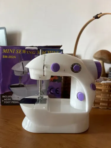 Máquina de costura SM-202A