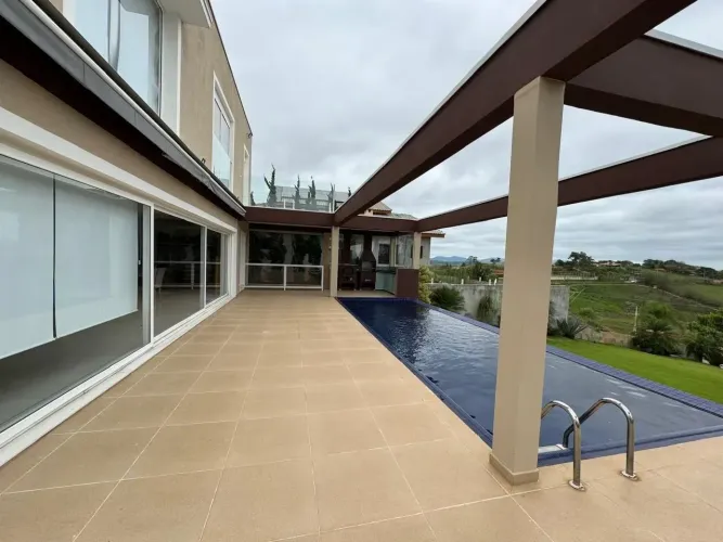 Casa com 4 dormitórios à venda, 400 m² por R$ 1.350.000,00 - Condomínio Lago Dourado - Jac