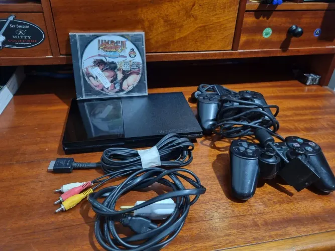 Playstation 2 com controle original e mais.