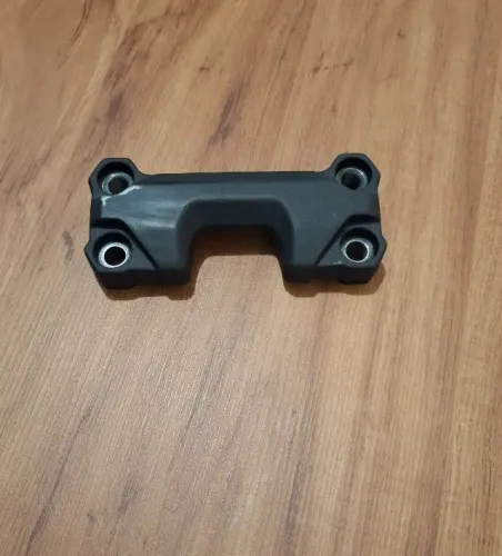 Fixador superior do guidão