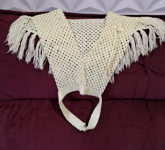 Poncho de tricot infantil