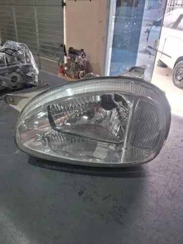 Farol esquerdo corsa lente vidro
