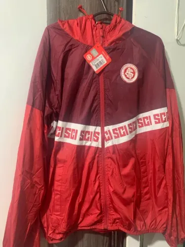 Corta vento oficial internacional