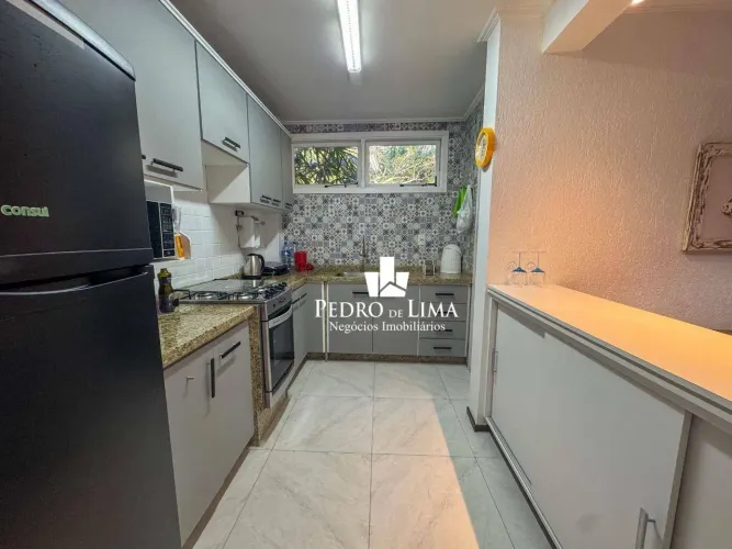 Village com 2 dormitórios à venda, 106 m² por R$ 1.500.000 - Riviera Módulo 26 - Bertioga/