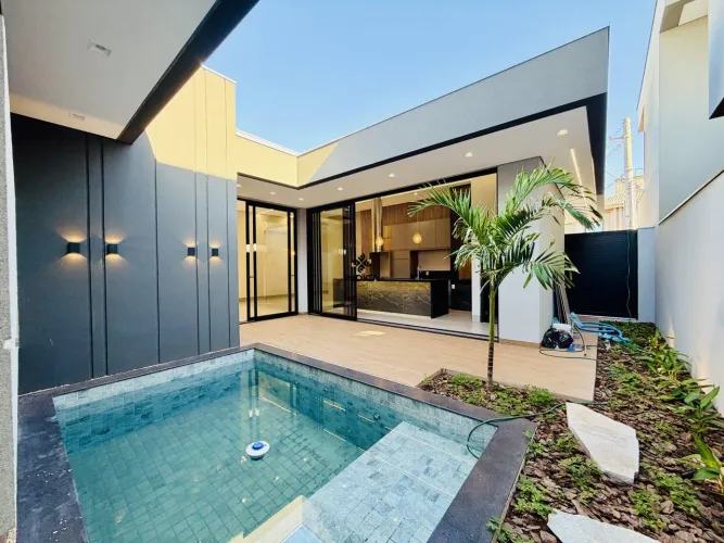 Casa nova de alto padrão com 3 suítes, piscina aquecida e cascata no Porto Unique Dourado