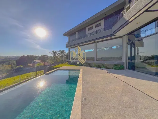 Casa de condomínio com 4 suítes, piscina, sauna e uma vista de tirar o folego