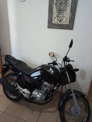 Vendo moto Honda com apenas 1350 km rodados350 Km 