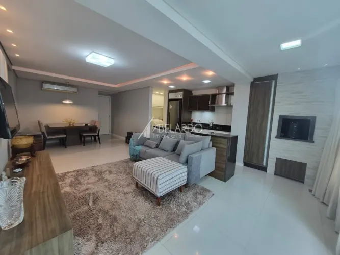 Apartamento semimobiliado com três dormitórios, duas vagas de garagem, próximo à Vila Germ