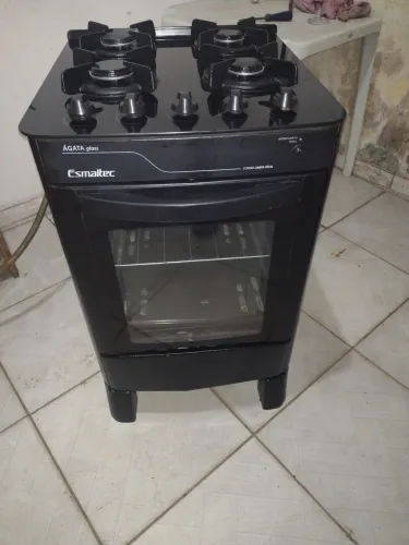 Fogão 4 bocas todo de vidro praticamente novo pra hj temos entrega não e elétrico 
