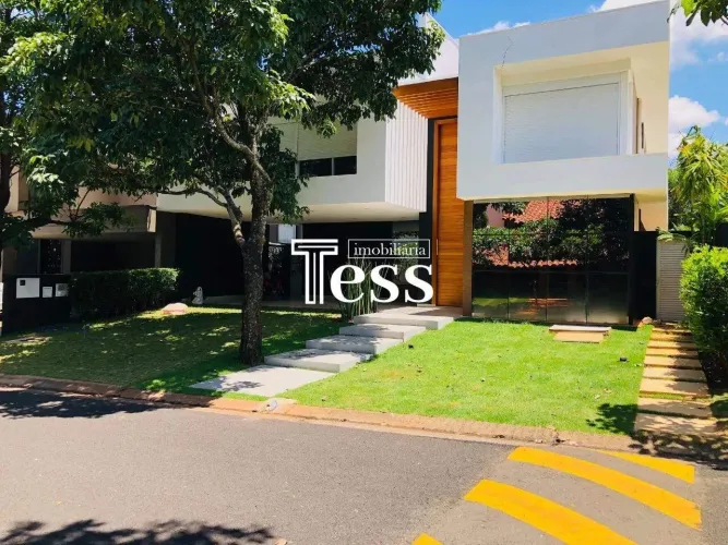 Vende se Casa em condomínio Harmonia Residence 4 suítes hidro elevador piscina portaria e
