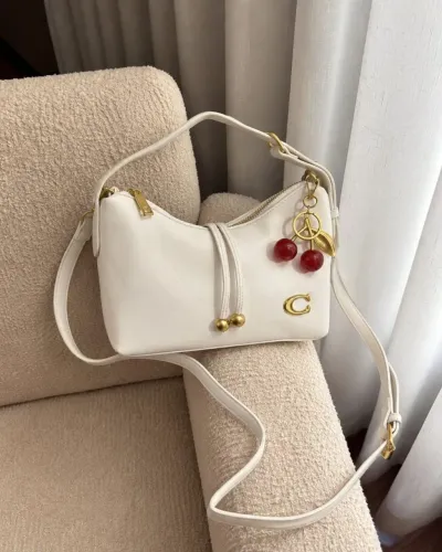 Bolsa Coach com chaveiro