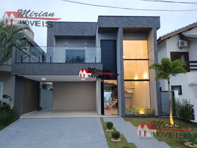 Casa de alto padrão em condomínio à venda em Peruíbe-SP, Jardim Três Marias: 4 quartos, 2 