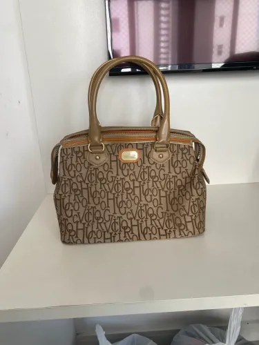     Bolsa Victor Hugo monograma bege em bom estado 