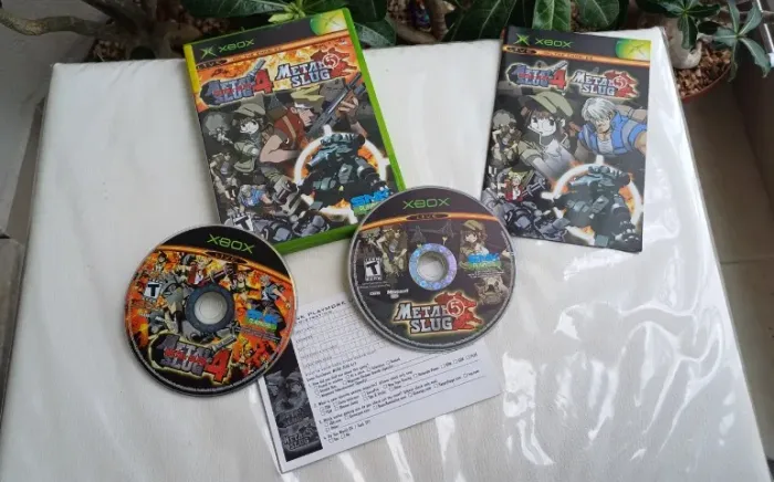 Jogo Metal Slug 4 E 5 Cib, C/ 2 Discos Impecável Xbox Raro