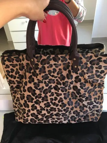 Bolsa e carteira onça pelos novos
