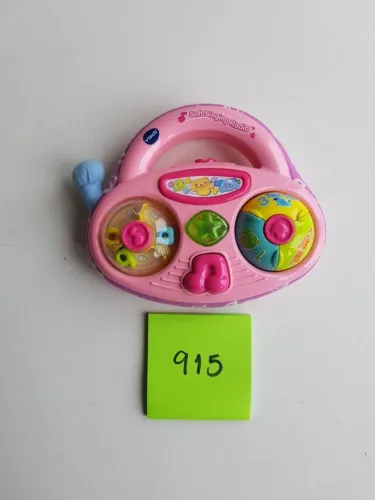 Vtech Soft Singing Radio Fala, toca, acende , faz diferentes sons.