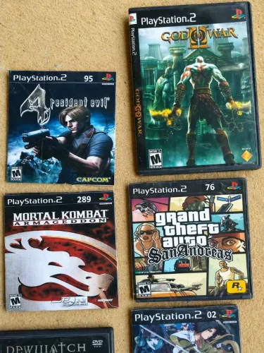 26 jogos PS2 RE4, God of War, Naruto Ultimate, GTA, DBZ, Racing 4 e muito mais
