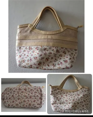 Bolsinha de mão Carmen Steffane tecido florido-com forro interno de cetim.