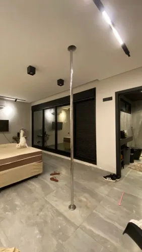 Barra de pole dance giratória com trava