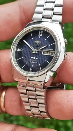 Relógio Orient automático Revisado, pulseira com todos os elos e fecho assinado.