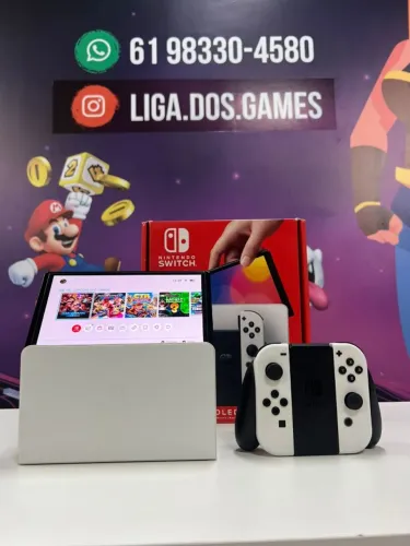 Nintendo Switch Oled 256gb desblo** com vários jogos instalados - 2.350,00 em dinheiro