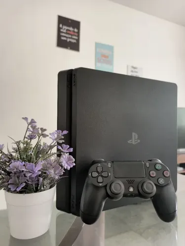 PS4 Slim 1 TB semi novo com caixa