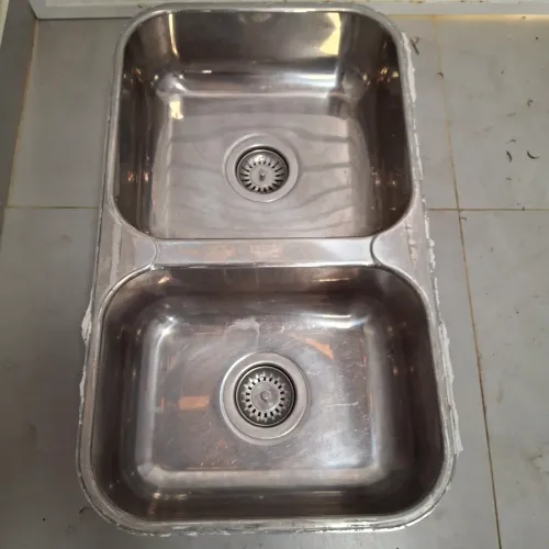 Cuba dupla de inox Tramontina medindo 69x40 cm