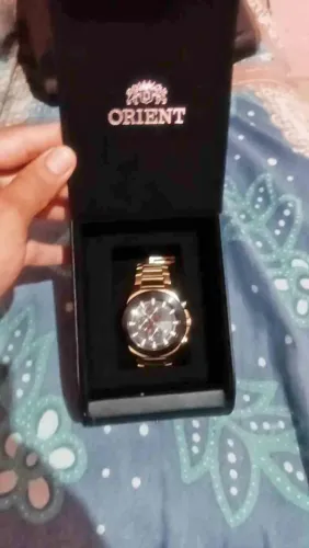 Relógio oriente dourado semi novo 