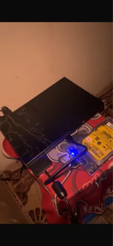 Ps2 tunado com 120 jogos.