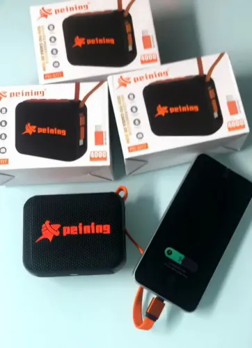 Caixa de Som e Carregador Portátil | 2 em 1 - Compatível com IPhone e Android. 