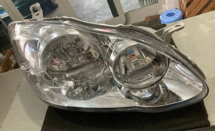 FAROL PRINCIPAL TOYOTA COROLLA 2005/2008 4 PORTAS MANUAL CROMADO DIREITO