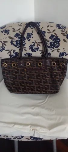 Bolsa famosa lona e alsa de couro em bom estado