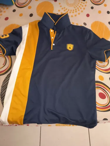 Camisa polo da New guerrents azul marinho com amarelo é branco 