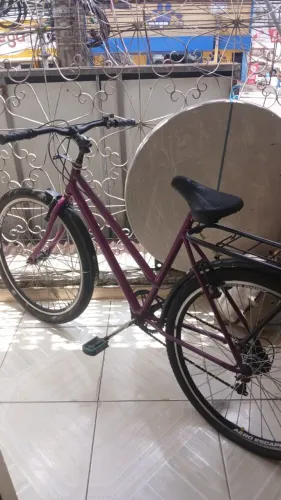 Bicicleta cairu roxa usada aro26 com garupa pneu aero escape pro