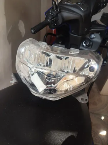 Farol original Fluo 125 