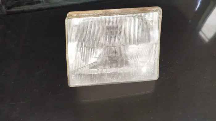 Farol uno 90  lado esquerdo original cibie 