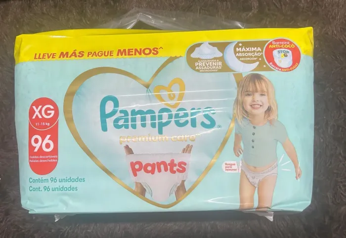 Fralda pampers premium xg 96