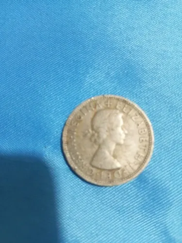 Moeda antiga da Rainha Elizabeth do ano de 1962.