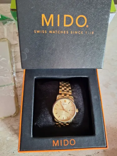 Relógio Mido Dourado trata fone *